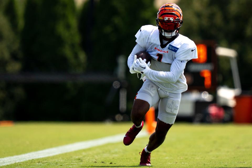 Cincinnati Bengals wide receiver Ja'Marr Chase (1) runs downfield during a drill with the receiving core and defensive secondary at the Cincinnati Bengals NFL training camp practice in Cincinnati on Thursday, Aug. 3, 2023. 