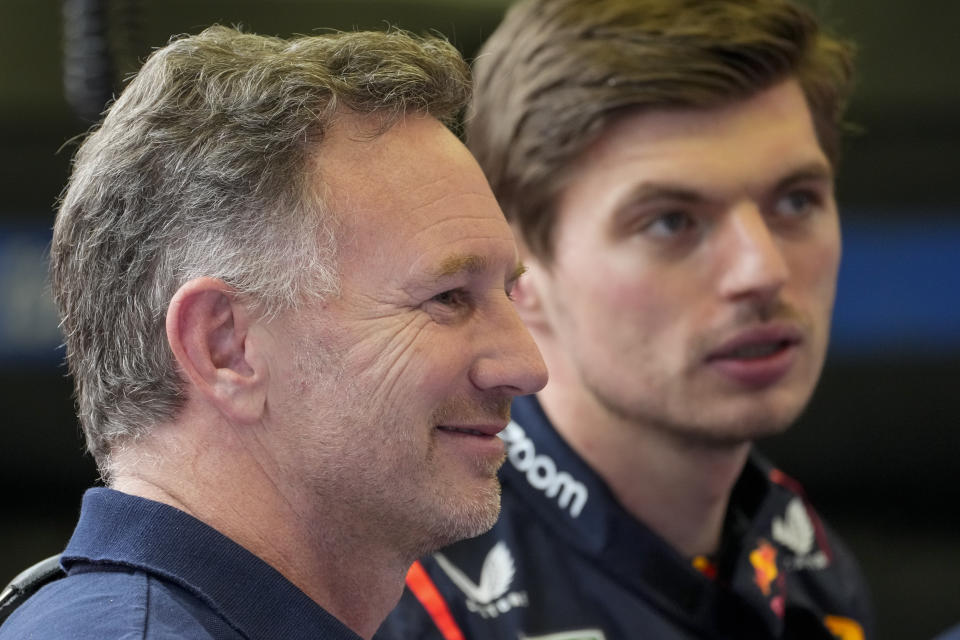 Red Bull team principal Christian Horner, left, and Red Bull driver Max Verstappen of the Netherlands are in the garage during Formula One pre season testings at the Bahrain International Circuit in Sakhir, Bahrain, Friday, Feb. 23, 2024. (AP Photo/Darko Bandic)