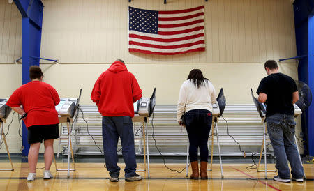 FILE PHOTO: Voters cast their votes during the U.S. presidential election in Elyria, Ohio, U.S. November 8, 2016. REUTERS/Aaron Josefczyk/File Photo/File Photo