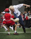 FILE - In this Oct. 15, 2015 file photo, Boris Johnson takes part in a Street Rugby tournament in a Tokyo street. (Stefan Rousseau/PA via AP)