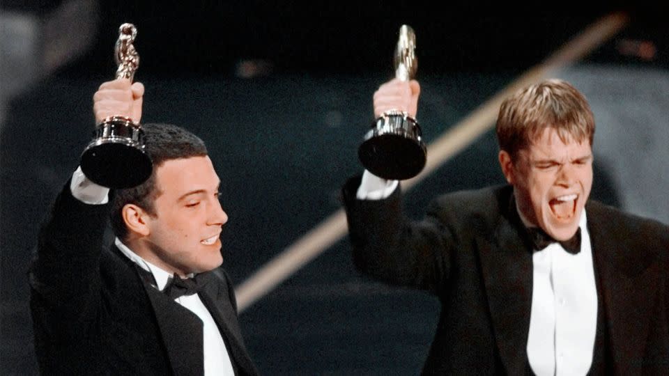 Ben Affleck and Matt Damon, right, react to winning the Oscar for best original screenplay for "Good Will Hunting" at the 70th Academy Awards in 1998. - Susan Sterner/AP