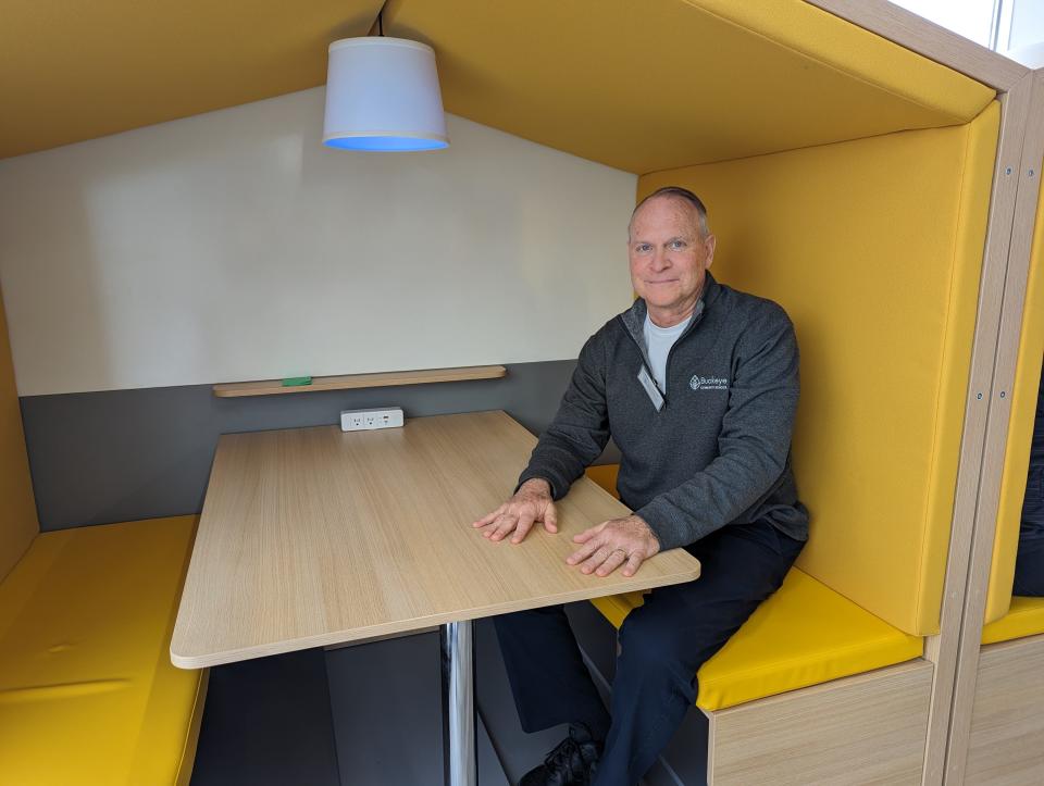 Buckeye Community School Vice Principal Steve Hofacker sits in one of the teaching nooks. The nook concept gives students and teachers a quiet one-on-one location that is also a desk with plug-ins for their laptops.