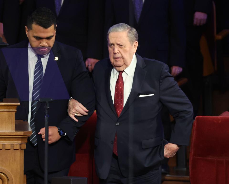President Jeffrey R. Holland, acting president of the Quorum of the Twelve Apostles, is helped to his seat during the funeral for President M. Russell Ballard of The Church of Jesus Christ of Latter-day Saints at the Salt Lake Tabernacle in Salt Lake City on Friday, Nov. 17, 2023. | Jeffrey D. Allred, Deseret News