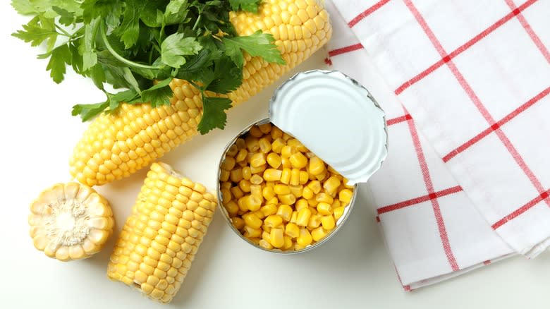 Open can of corn with cobs