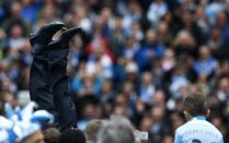 Manchester City's manager Manuel Pellegrini is thrown into the air by his team as they celebrate winning the English Premier League trophy following their soccer match against West Ham United at the Etihad Stadium in Manchester, northern England May 11, 2014. REUTERS/Darren Staples (BRITAIN - Tags: SPORT SOCCER) FOR EDITORIAL USE ONLY. NOT FOR SALE FOR MARKETING OR ADVERTISING CAMPAIGNS. NO USE WITH UNAUTHORIZED AUDIO, VIDEO, DATA, FIXTURE LISTS, CLUB/LEAGUE LOGOS OR "LIVE" SERVICES. ONLINE IN-MATCH USE LIMITED TO 45 IMAGES, NO VIDEO EMULATION. NO USE IN BETTING, GAMES OR SINGLE CLUB/LEAGUE/PLAYER PUBLICATIONS