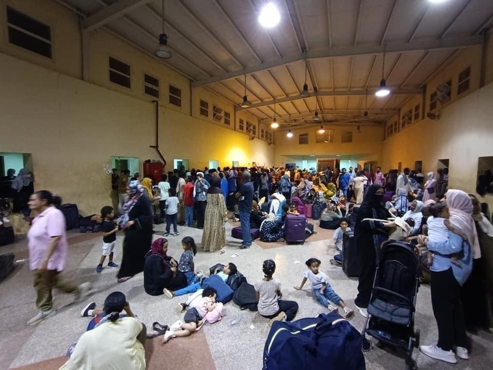 Sudanese civilians are seen in a holding area on the Egyptian side of the Argeen border crossing with Sudan, April 24, 2023, in a photo provided to CBS News by a Sudanese student who fled the violence in her country. / Credit: CBS News