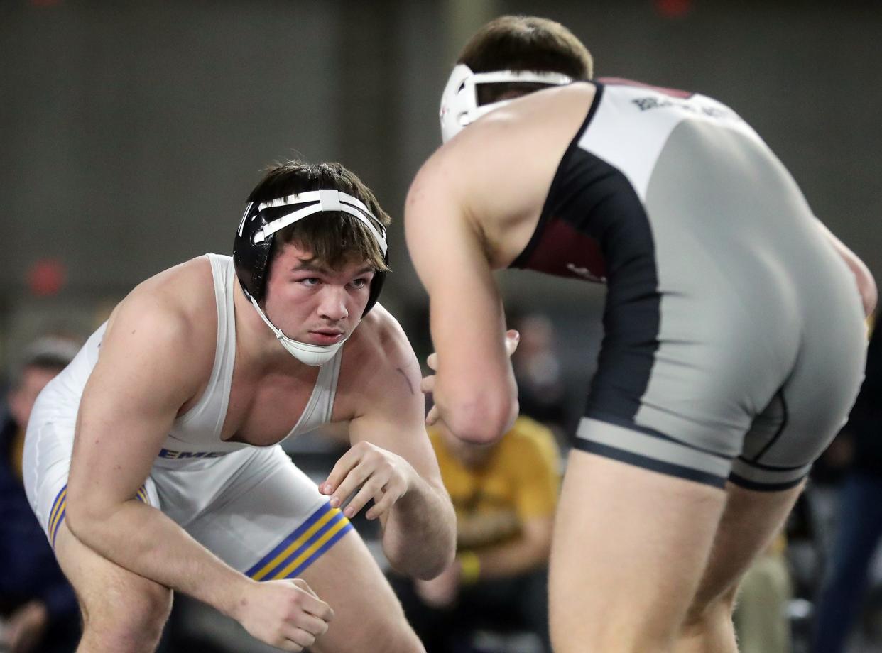 Bremerton’s Thor Michaelson wrestles WF West’s Tucker Land for their 170-pound championship bout during the Mat Classic Championships at the Tacoma Dome on Saturday, Feb. 18, 2023. 