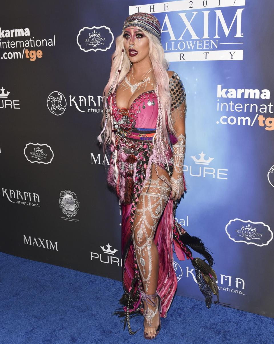 <p>Former Danity Kane singer <strong>AUBREY O'DEY</strong> arrived at the Maxim Halloween party as A Nightmare You Had After Having Hypnotiq And Skittles For Dinner. </p>