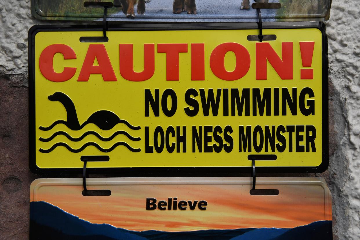 Loch Ness monster-themed signs are sold at Nessieland in Drumnadrochit in the Scottish Highlands on August 27, 2023. The biggest search for the Loch Ness Monster in five decades got underway in the Scottish Highlands, as researchers and enthusiasts from around the world braved pelting rain to try to track down the elusive Nessie. The expedition deployed drones with thermal scanners, boats with infrared cameras and an underwater hydrophone to try to unravel a mystery that has captivated the world for generations. (Photo by ANDY BUCHANAN / AFP) (Photo by ANDY BUCHANAN/AFP via Getty Images)