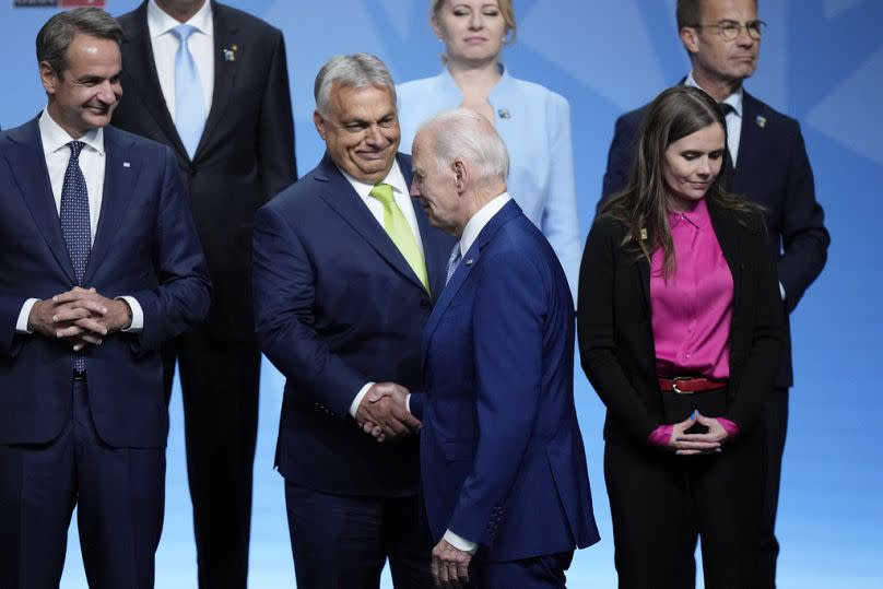 Hungary's Prime Minister Viktor Orban shakes hands with US President Joe Biden, prior to a group photo at a NATO summit in Vilnius, January 2023
