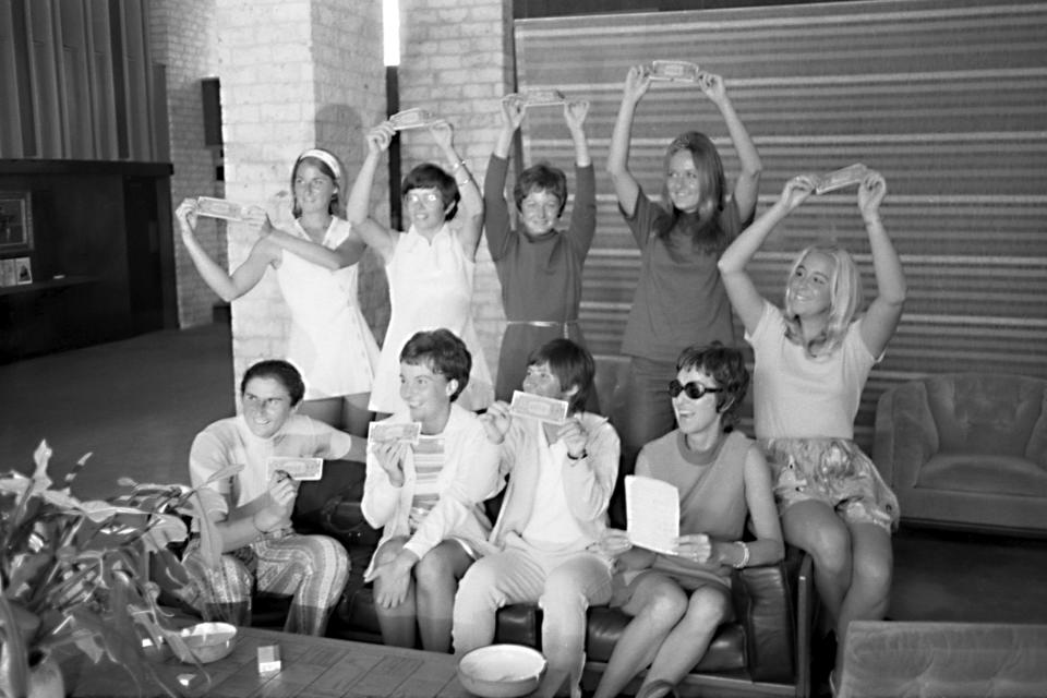 In this Sept. 23, 1970, photo provided the Houston Library, tennis players hold up $1 bills after signing a contract with World Tennis magazine publisher Gladys Heldman to turn pro and start the Virginia Slims tennis circuit. From left standing are: Valerie Ziegenfuss, Billie Jean King, Nancy Richey and Peaches Bartkowicz. From left seated are: Judy Tegart Dalton, Kerry Melville Reid, Rosie Casals, Gladys Heldman and Kristy Pigeon. Gladys Heldman replaced her daughter, Julie Heldman, who was injured and unable to pose for the 1970 photo. It’s the 50th anniversary of Billie Jean King and eight other women breaking away from the tennis establishment in 1970 and signing a $1 contract to form the Virginia Slims circuit. That led to the WTA Tour, which offers millions in prize money. (Bela Ugrin/Courtesy Houston Library via AP)