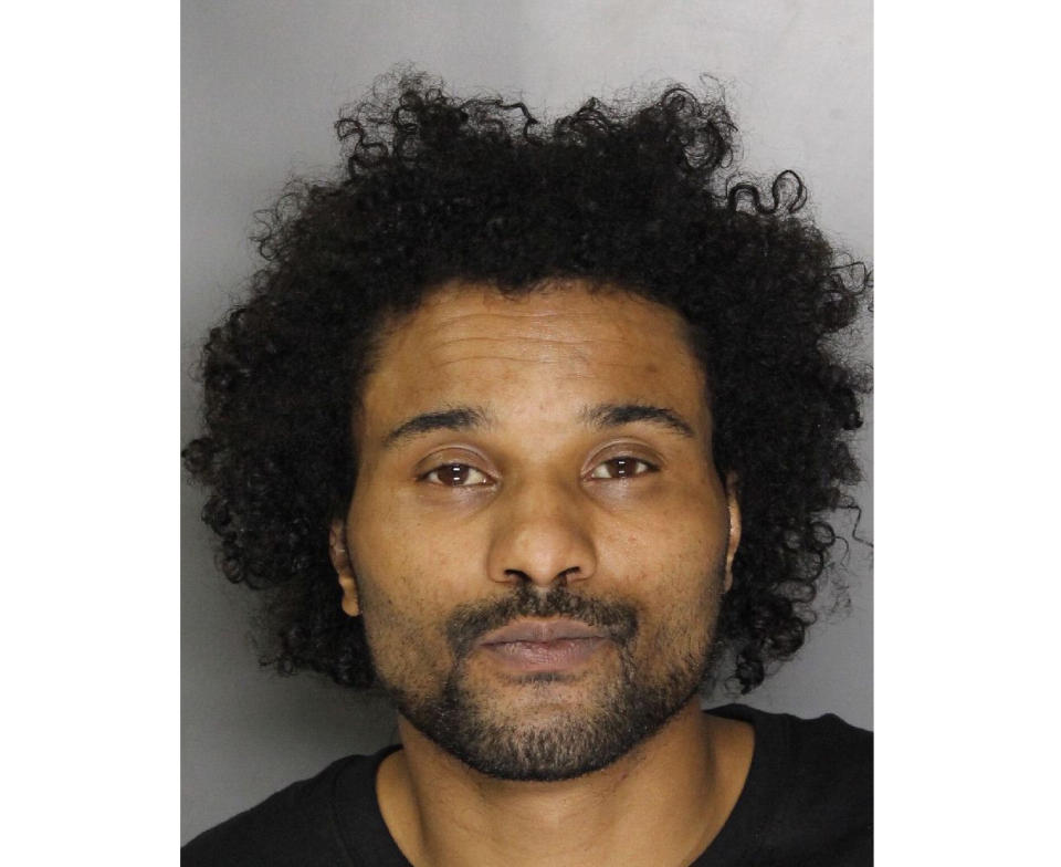 This undated handout photo provided by the Sacramento County Sheriff's Department on Tuesday, Sept. 18, 2018, shows suspect Anton Lemon Moore, 38, who is accused of fatally shooting a Sacramento County Sheriff's deputy and wounding another deputy during a shootout in Rancho Cordova, Calif., the day before. Moore was wounded in the gun battle and was hospitalized. (Sacramento County Sheriff's Department via AP)