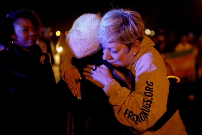 Sara Cunningham hugs Vivian Stevenson during a Transgender Day of Remembrance. Stevenson's daughter, Brooklyn BreYanna, was killed in 2017.