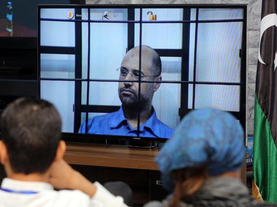 Gaddafi gave evidence to the Tripoli court via video link from the mountain town of Zintan (AFP/Getty)