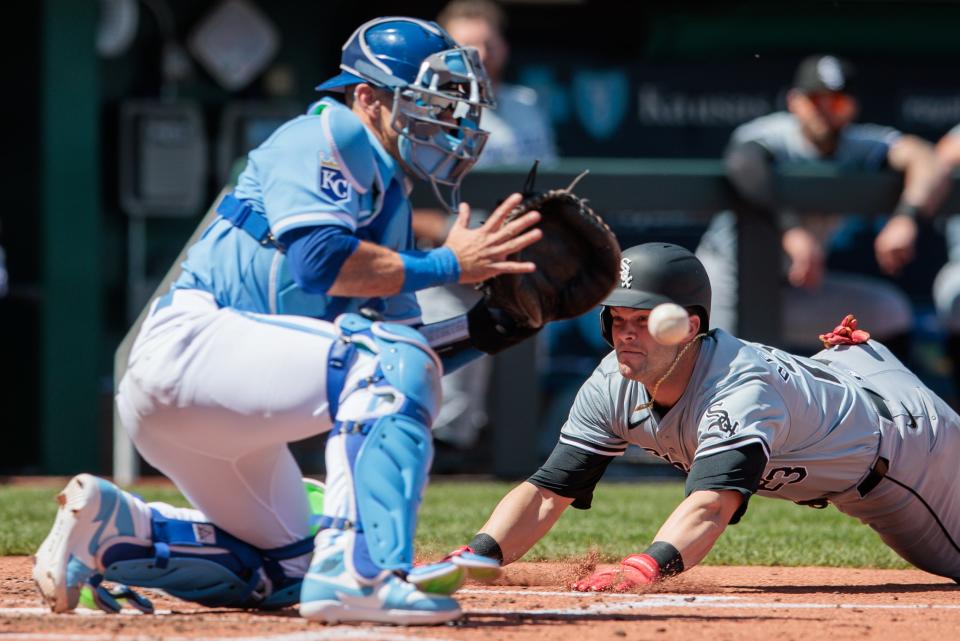 Cincinnati's Andrew Benintendi, here diving into home in a game against the Kansas City Royals this week, is on a White Sox team that continues to struggle after trying a rebuild. They entered Wednesday's games 2-9.