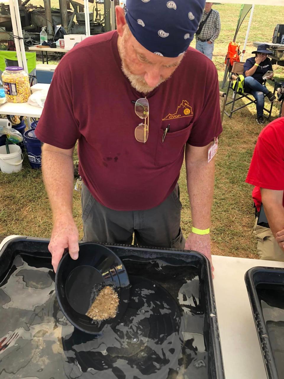 Central Virginia Gold Prospectors member David Shaw of Goochland pans gold at Field Day of the Past 2022 in Amelia.