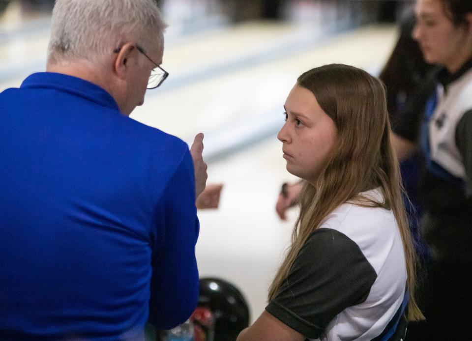Washburn Rural assistant coach Steve Peoples speaks with Claire Ireland during last year's 6A State Bowling Tournament. Ireland, a leader on the team this year, credits Peoples with helping the newcomers transition to varsity.