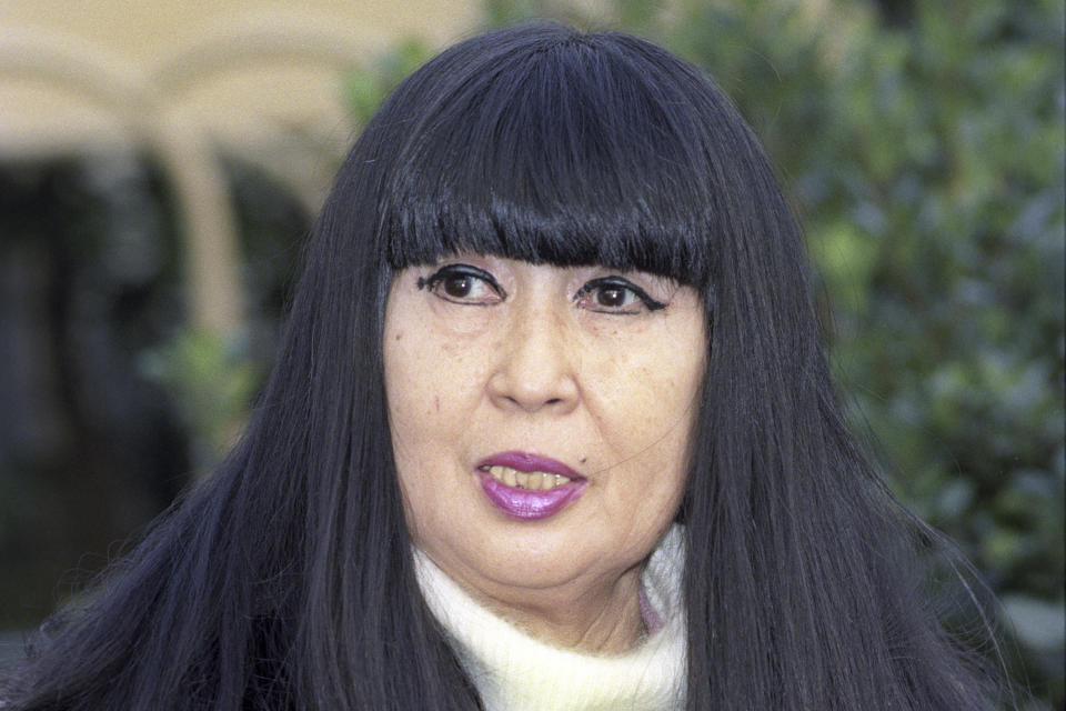 Kazuko Shiraishi speaks at a park in Tokyo, on Nov. 15, 1996. Shiraishi, a leading name in modern Japanese “beat” poetry, known for her dramatic readings, at times with jazz music, died of heart failure on June 14, according to a Tokyo publisher of her works on Wednesday, June 19, 2024. She was 93. (Kyodo News via AP)