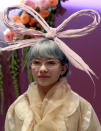 Tavi Gevinson attended Dior's Haute Couture show in Paris in 2010. Her headpiece fitted perfectly for the occasion. <br><br>© Rex