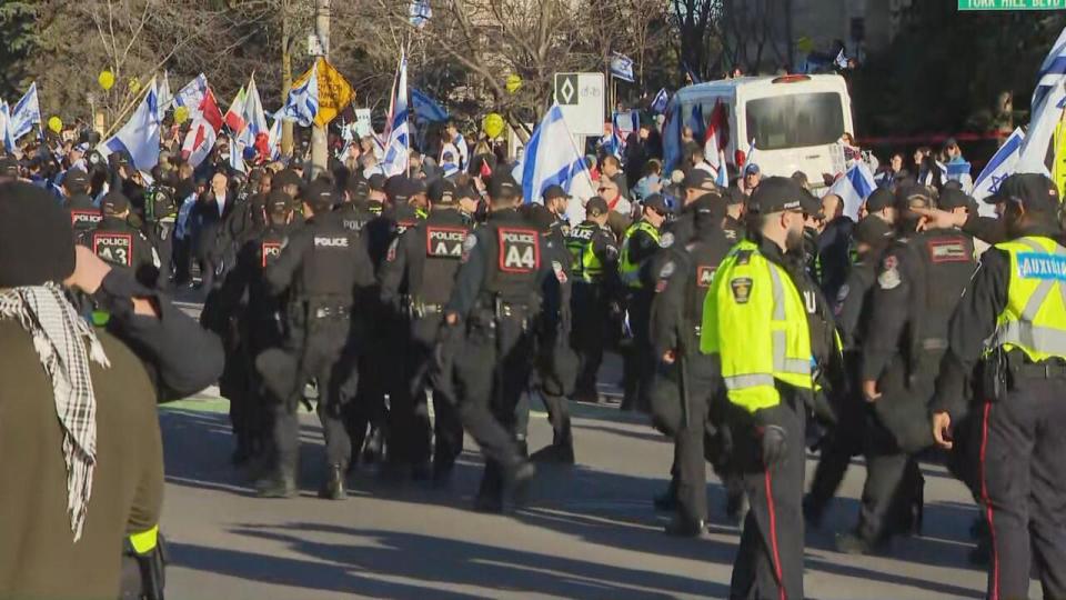 York Regional Police were present for protests outside of a synagogue in Thornhill, Ont., on Thursday. In an update Friday, police said they arrested three people during the demonstrations. (Chris Langenzarde/CBC News - image credit)