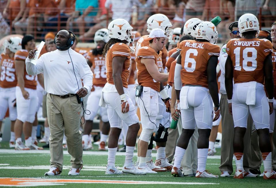 Texas coach Charlie Strong was flagged for unsportsmanlike conduct while arguing a call during a 30-27 home loss to Oklahoma State in 2015. The Horns and Cowboys meet for the final time as Big 12 rivals in Saturday's conference title game at AT&T Stadium in Arlington.