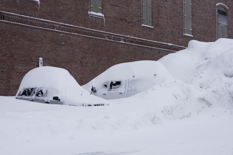 Vehicles are covered in snow during a storm, Sunday, March 3, 2024, in Truckee, Calif. (AP Photo/Brooke Hess-Homeier)