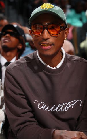 <p>David L. Nemec/NBAE via Getty</p> Pharrell Williams