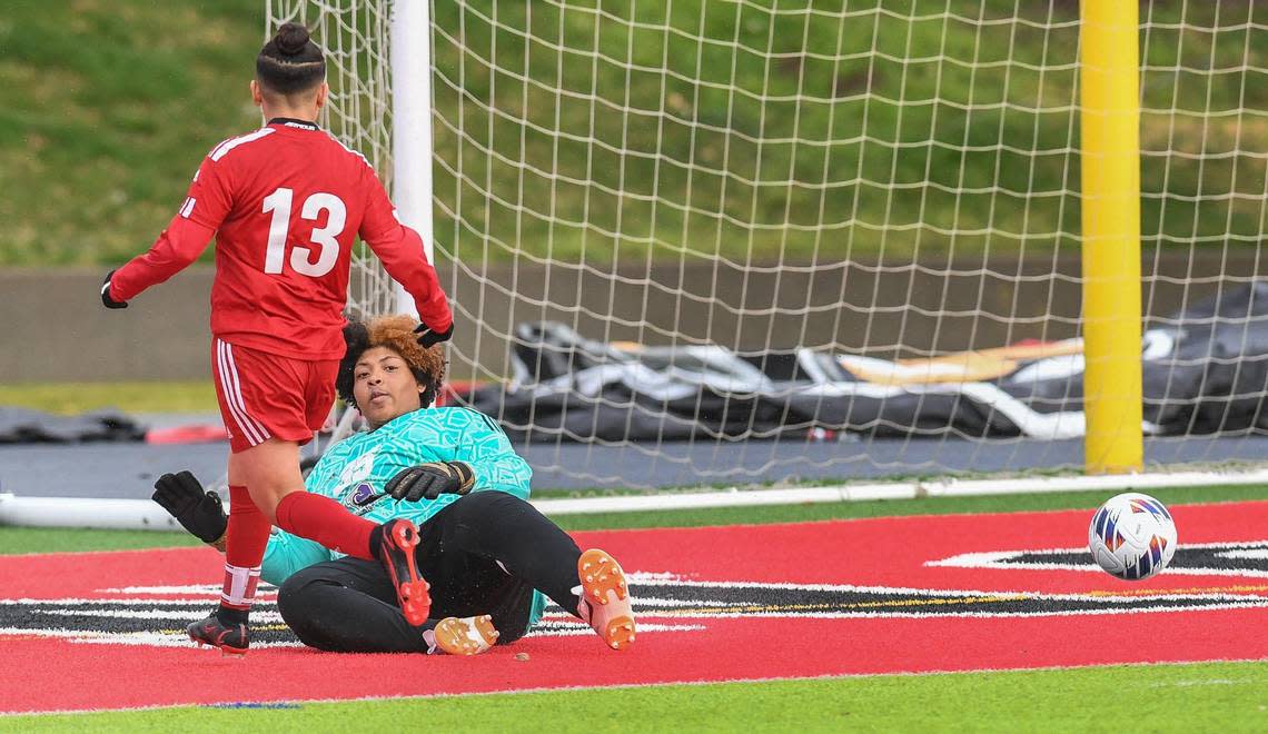 McLane’s Yadira Dominguez, left, shoots the ball past Desert’s goal keeper for a goal in the second half during their Central Section playoff game at McLane Stadium on Monday, Feb. 27, 2023.