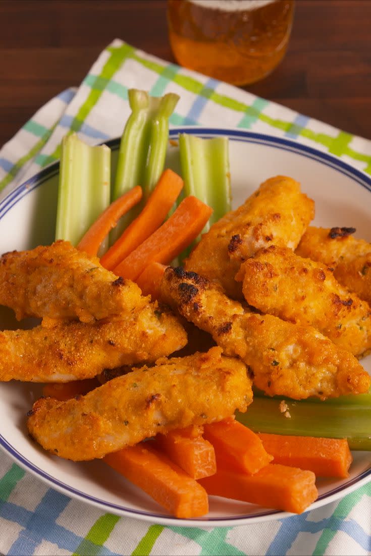 <p>Ever just wish there was more chicken on a wing? These tender (literal) tenders are just that. And best of all, they're gluten-free!</p><p>Get the <strong><a href="https://www.delish.com/cooking/recipe-ideas/recipes/a57755/buffalo-chicken-tenders-recipe/" rel="nofollow noopener" target="_blank" data-ylk="slk:Buffalo Chicken Tenders recipe;elm:context_link;itc:0;sec:content-canvas" class="link ">Buffalo Chicken Tenders recipe</a></strong>. </p>