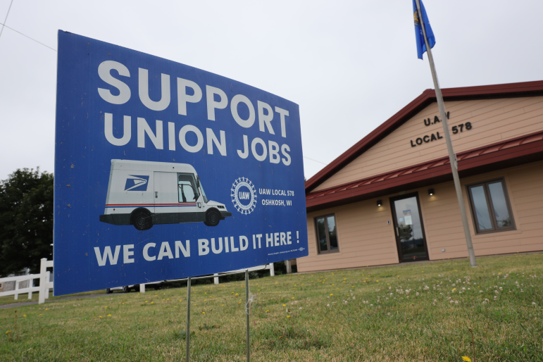 A pro-union sign is seen in front of the United Auto Workers Union building in Oshkosh. The UAW shop is located across the street from the Oshkosh Defense facility. Oshkosh Defense announced in 2021 that it would not build up to 165,000 postal trucks using its existing Oshkosh assembly lines but shift production to a new $155 million plant in Spartanburg, S.C.