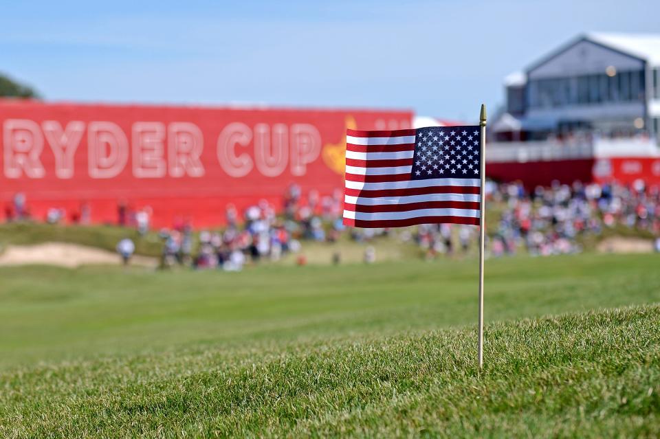 An American flag in the ground on the 18th hole.