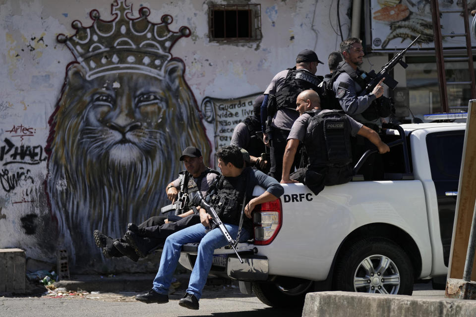 Military police occupy the Jacarezinho favela in Rio de Janeiro, Brazil, Wednesday, Jan. 19, 2022. Military police started to occupy the favela as the first phase of Rio de Janeiro state government's new program against organized crime and promises of social interventions. (AP Photo/Silvia Izquierdo)