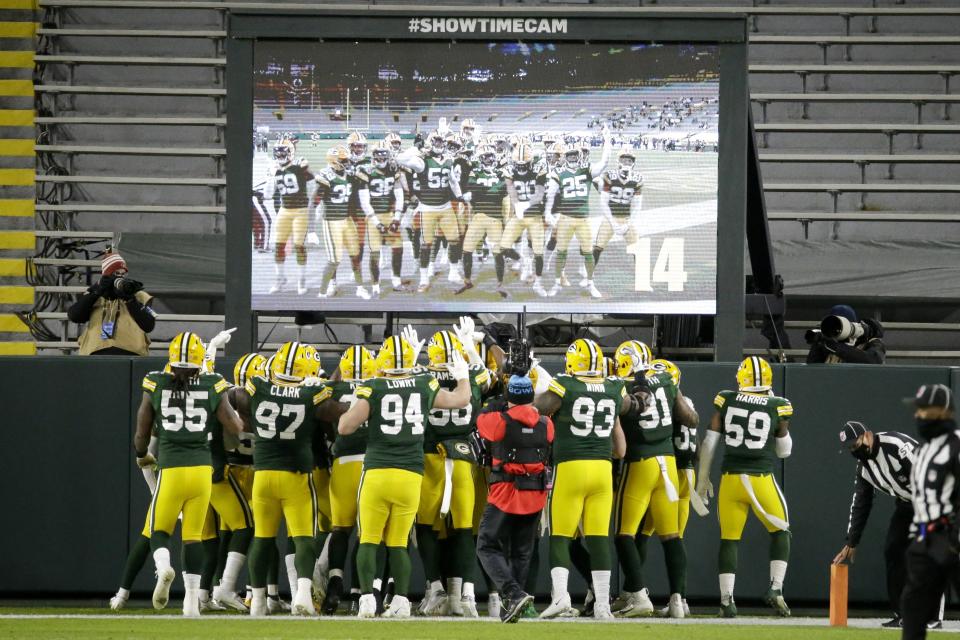 Green Bay Packers players help Darnell Savage celebrate his interception in the end zone during the first half of an NFL football game against the Chicago Bears Sunday, Nov. 29, 2020, in Green Bay, Wis. (AP Photo/Mike Roemer)