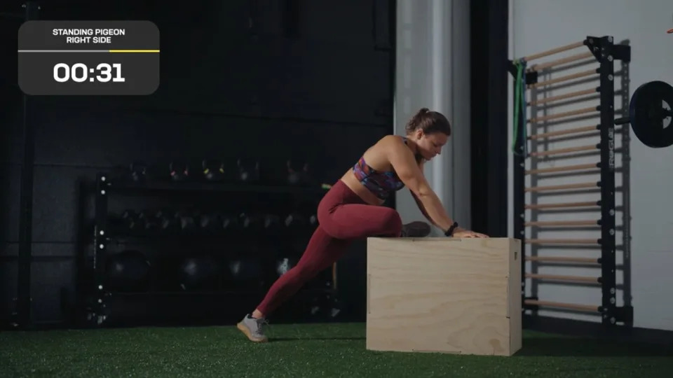 CrossFit and Pliability athlete Laura Horvath completing a standing pigeon stretch