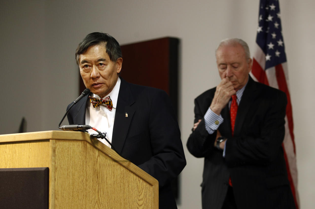 University of Maryland president Wallace Loh, left, speaks at a news conference in front of James Brady, chairman of the University System of Maryland Board of Regents, following the board’s recommendation that football head coach DJ Durkin retain his job. (AP Photo/Patrick Semansky)