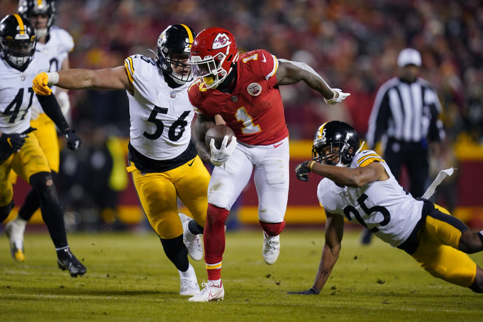 Kansas City Chiefs running back Jerick McKinnon (1) runs from Pittsburgh Steelers outside linebacker Alex Highsmith (56) and cornerback Ahkello Witherspoon (25) during the first half of an NFL wild-card playoff football game, Sunday, Jan. 16, 2022, in Kansas City, Mo. (AP Photo/Ed Zurga)