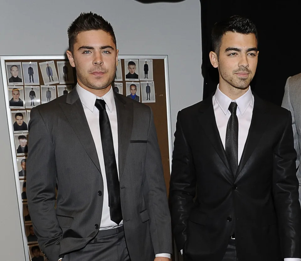 Joe Jonas, Kellan Lutz and Zac Efron attend the Calvin Klein Men's Collection Fall 2011 fashion show during Mercedes-Benz Fashion Week at 205 West 39th Street on February 13, 2011 in New York City.