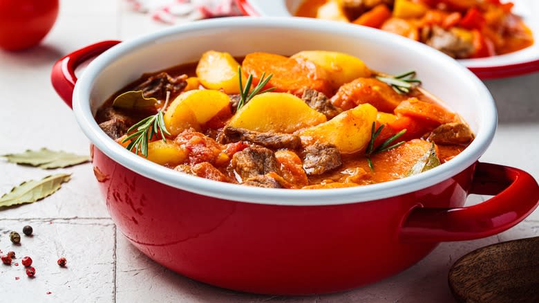 beef bourguignon in red pot
