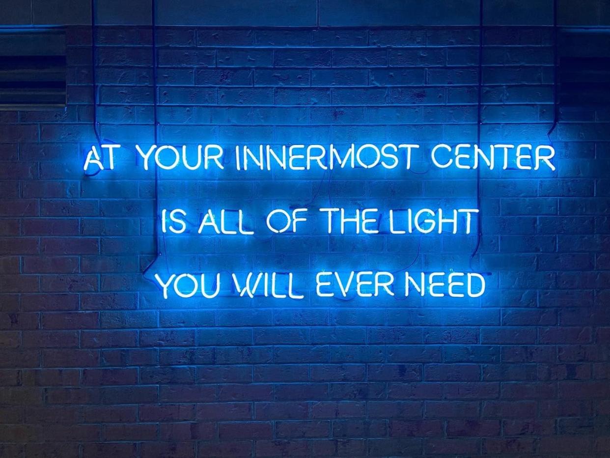 Troy Ramos' neon work "At Your Innermost Center" is shown. The piece is one of two outdoor public art installations at 80 W. Michigan Ave.