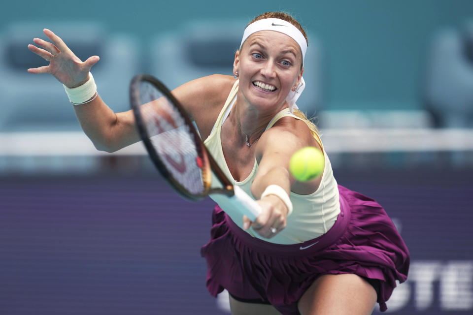 Petra Kvitova, of the Czech Republic, reaches for a shot from Sorana Cirstea, of Romania, in a semifinal of the Miami Open tennis tournament Friday, March 31, 2023, in Miami Gardens, Fla. (AP Photo/Jim Rassol)