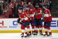 Florida Panthers center Anton Lundell (15) reacts with teammates after scoring a goal during the first period of an NHL hockey game against the Buffalo Sabres, Saturday, April 13, 2024, in Sunrise, Fla. (AP Photo/Lynne Sladky)