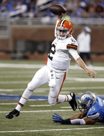 Browns quarterback Johnny Manziel (2) escapes diving Lions outside linebacker Kyle Van Noy (95) in the second half Saturday. (AP Photo)