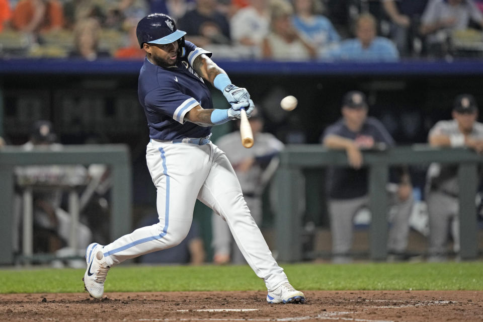 Kansas City Royals' Nelson Velazquez hits a solo home run during the fourth inning of a baseball game against the Houston Astros Friday, Sept. 15, 2023, in Kansas City, Mo. (AP Photo/Charlie Riedel)