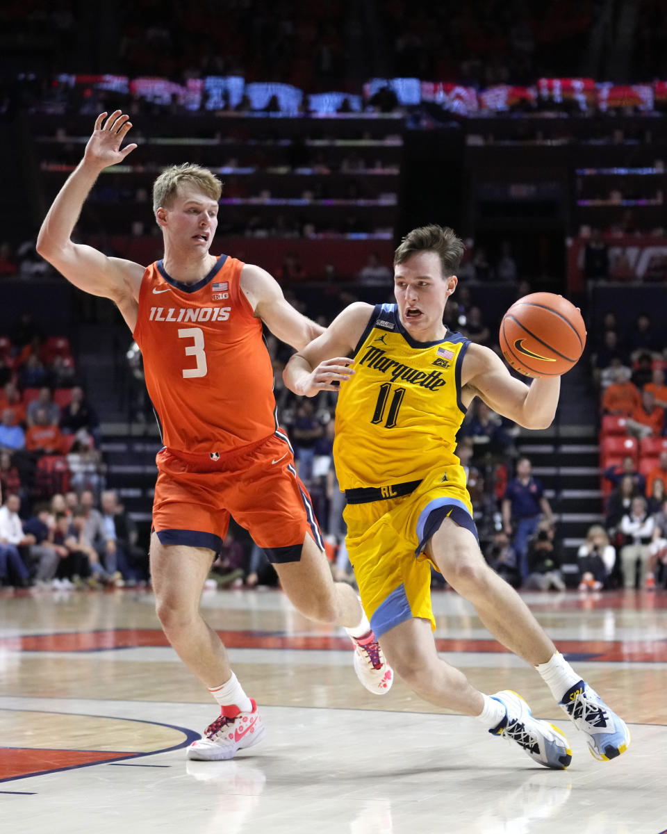 Marquette guard Tyler Kolek (11) drives to the basket as Illinois forward Marcus Domask defends during the second half of an NCAA college basketball game Tuesday, Nov. 14, 2023, in Champaign, Ill. (AP Photo/Charles Rex Arbogast)
