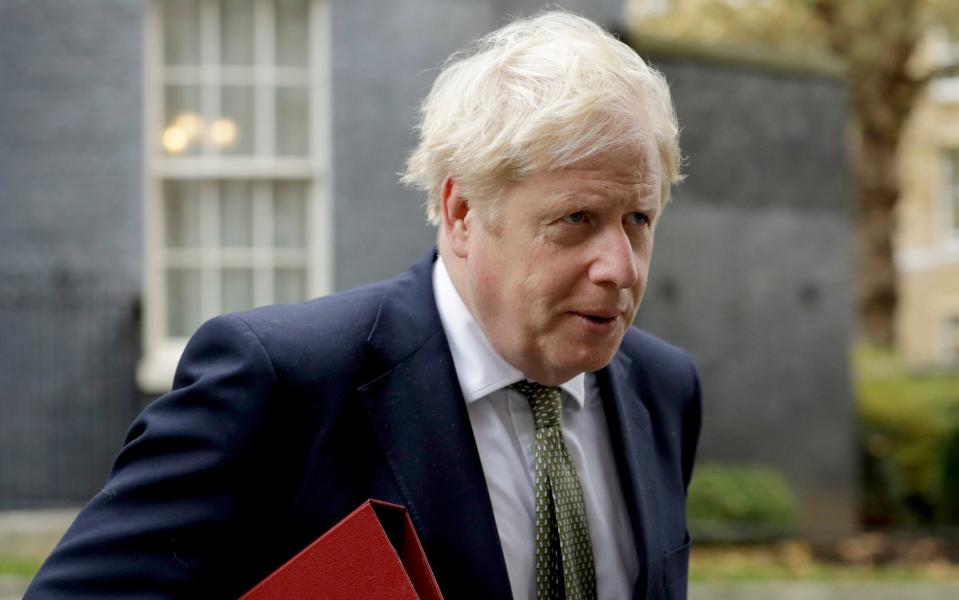 Prime Minister Boris Johnson walks from 10 Downing Street  - Matt Dunham /AP