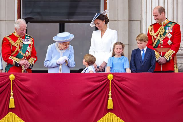 <p>Chris Jackson/Getty Images</p> (From left) The future King Charles, Queen Elizabeth, Prince Louis, Kate Middleton, Princess Charlotte, Prince George and Prince William on the balcony of Buckingham Palace during the Trooping the Colour parade on June 02, 2022.