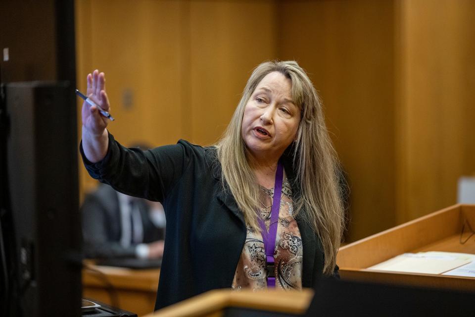 Lakeland Police Crime Scene Technician Kimberly Patterson walks the jury through crime-scene photos during Marcelle Waldon's first-degree murder trial in Bartow on Tuesday. Waldon is charged with the murder of Edie Yates Henderson and her husband, David Henderson.