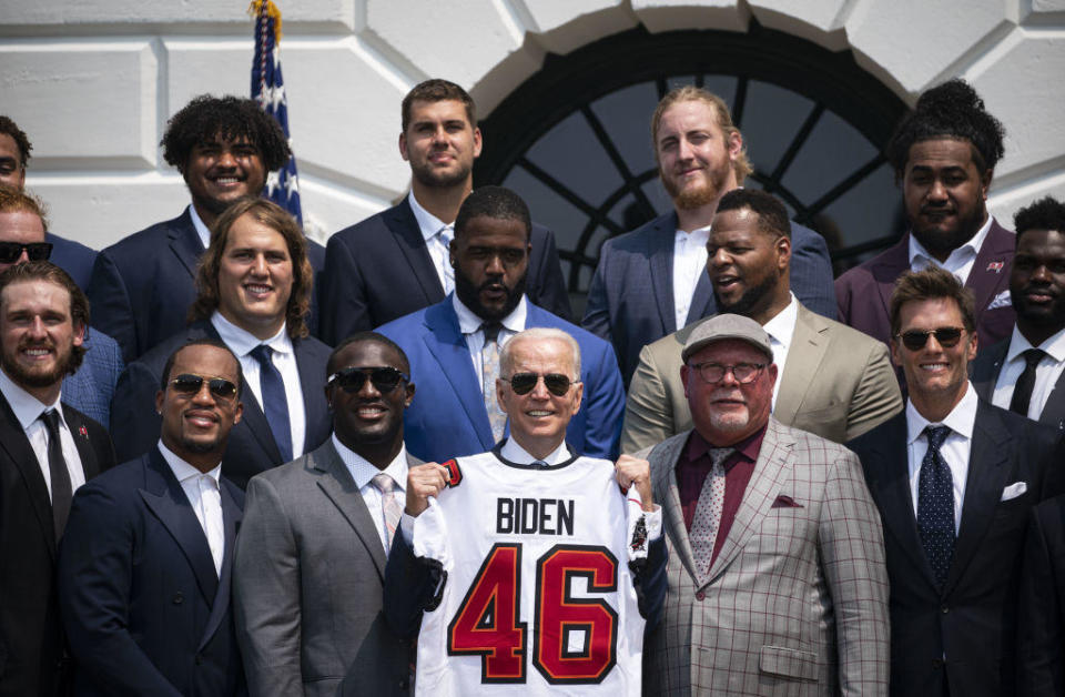 President Biden, center, with the Super Bowl champion Tampa Bay Buccaneers on July 20, 2021. / Credit: Al Drago/Bloomberg via Getty