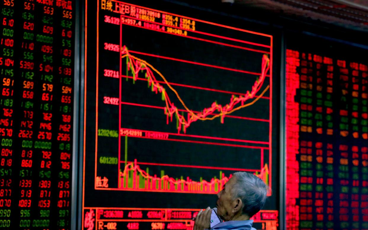 Stock market screen - Andy Wong/AP