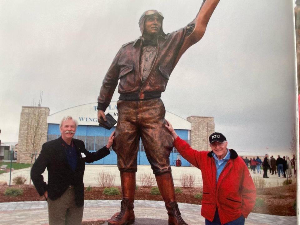 Sculptor George Lundeen, left, poses with Jack Wolf in 2012 after the unveiling of the Elrey Jeppesen statue at the Poplar Grove Vintage Wings & Wheels Museum. Wolf and his wife, Peggy, commissioned the statue and donated it to the museum.